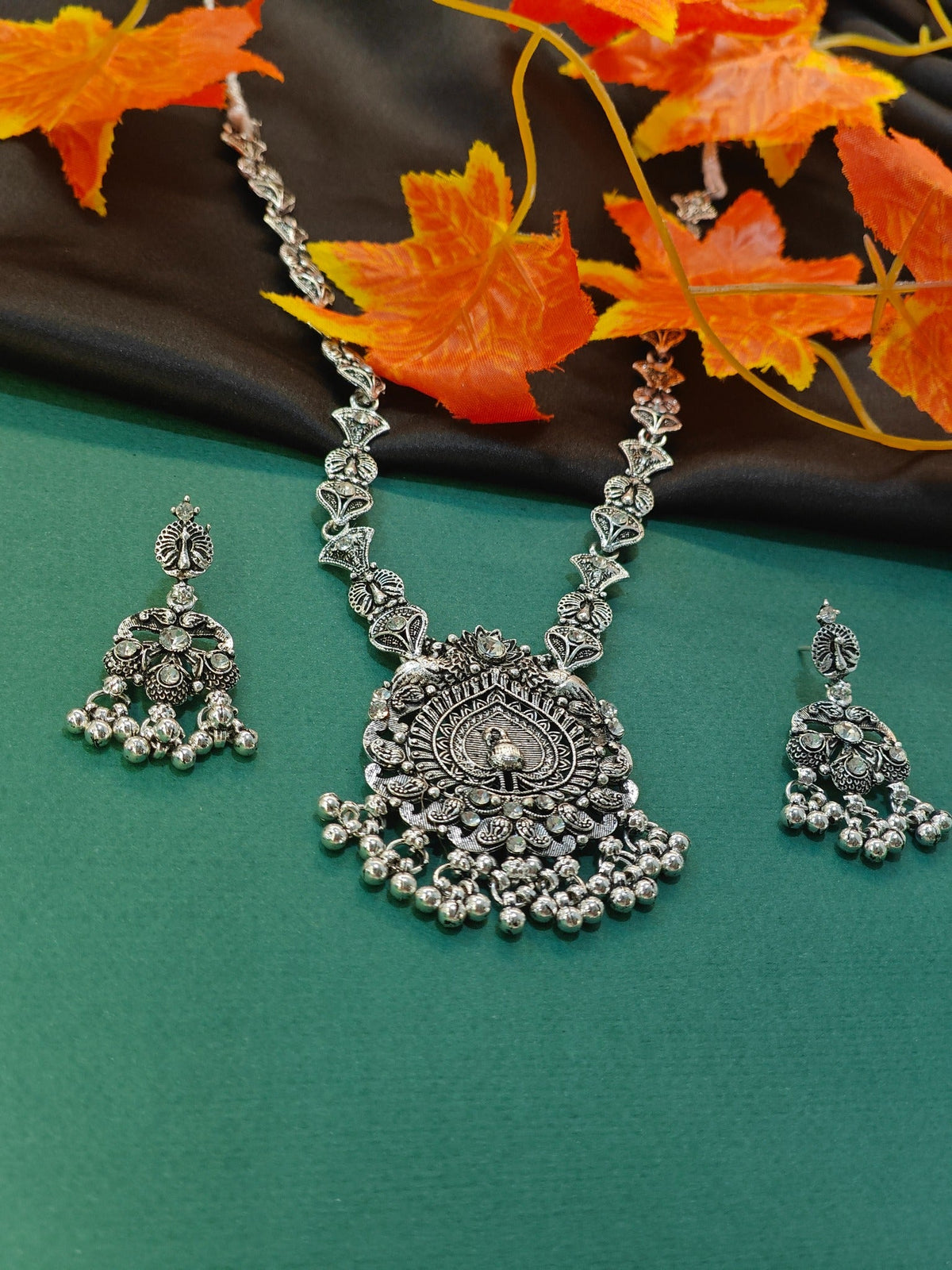 Peacock ghungroo oxidised necklace set with matching statement earrings