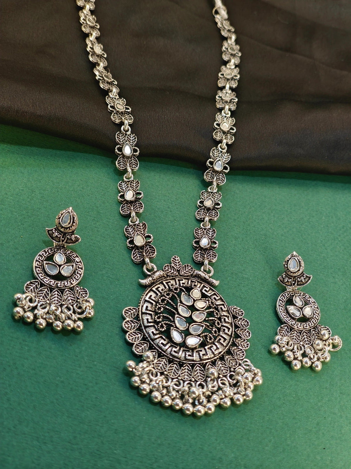 White-stone leaf medallion oxidised necklace set with matching earrings