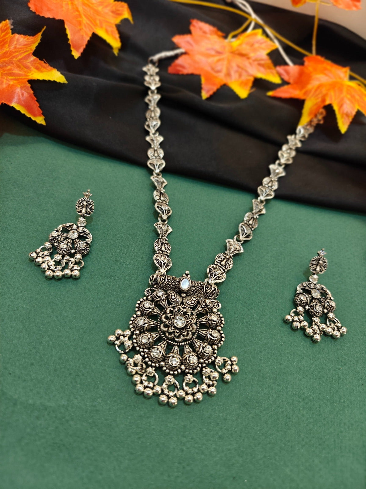 Classic floral ghungroo oxidised necklace set with matching earrings