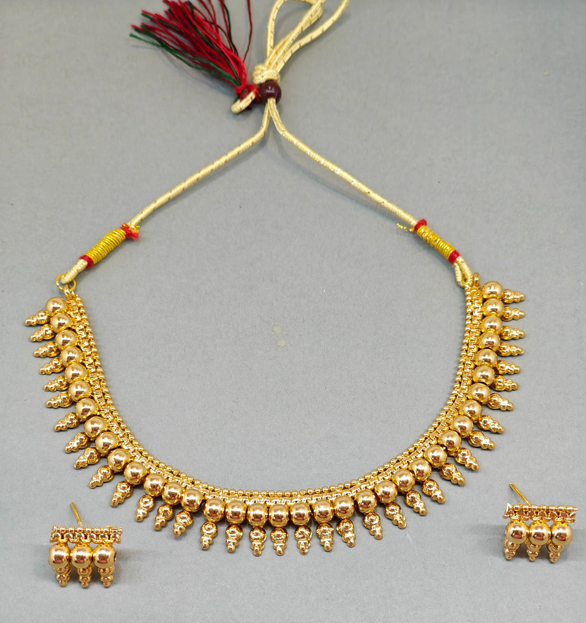 Traditional gold-tone ghungroo necklace set with matching earrings